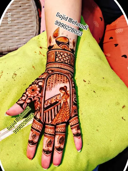 A special design for the festival of Karva Chauth. This single-hand mehandi features a traditional scene of a woman with the 'chalni' (sieve), combining figurative art with elegant patterns on the fingers.