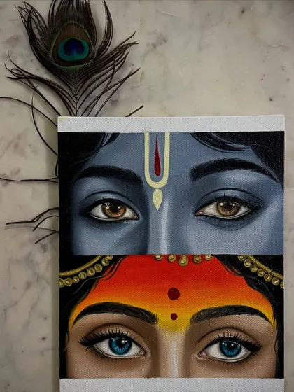 The Radha Krishna eyes painting, styled with a real peacock feather.