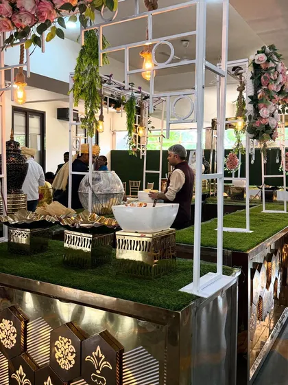 This is one of my modern buffet setups, designed with a clean white frame, elegant florals, and gold accents to create a grand first impression for your event guests.