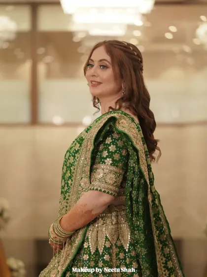A candid moment of pure happiness from an engagement celebration. I created this soft glam look with radiant skin and gentle contouring to complement her beautiful green lehenga, ensuring she looked and felt effortlessly elegant.