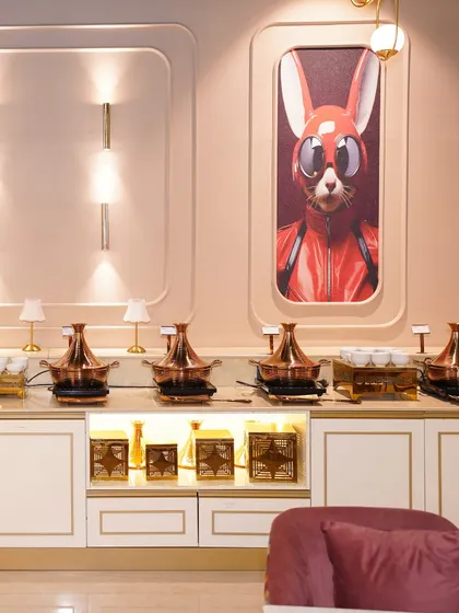 Our premium buffet station, ready to serve delicious global cuisine to guests. The stylish setup and artistic wall decor complement the five-star dining experience we provide.
