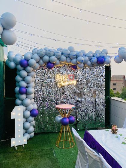 The complete first anniversary setup on the terrace, ready for an evening celebration with friends and family.