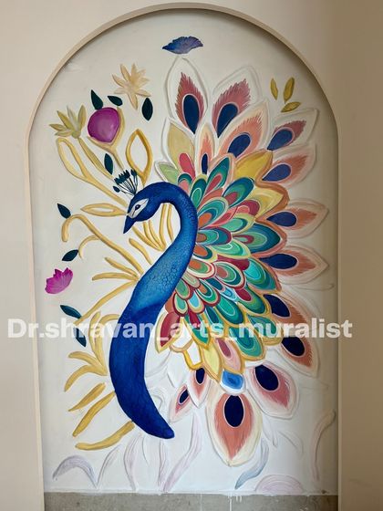 Here is a close-up of a peacock relief mural, this time in a niche. The feathers are individually sculpted and painted with a vibrant, multi-color palette, making it a joyful and eye-catching piece.