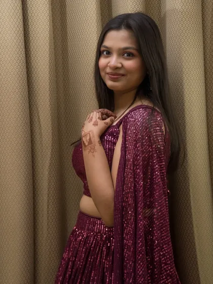 A three-quarter portrait from the indoor lehenga shoot. The pose is simple and elegant, focusing on the model.