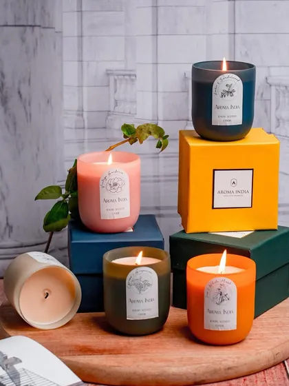 Start your morning with a fragrant delight. Our frosted glass candles, shown here in a variety of colors and scents, are perfect for setting a positive and calming mood for the day ahead.