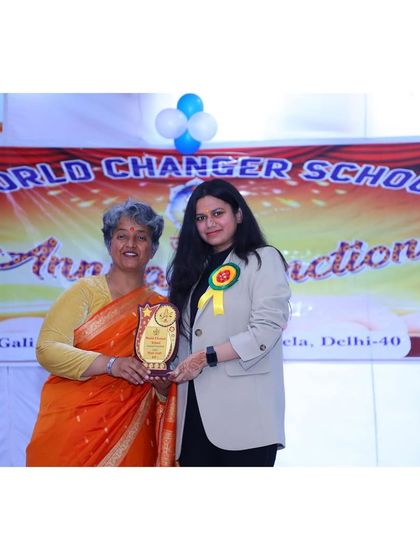Receiving a memento at the World Changer School event. Engaging with the community, especially with children, is a deeply rewarding experience that reminds me of the importance of building a better future.