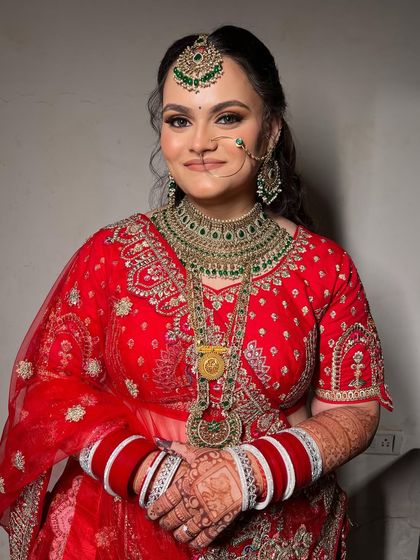 A happy and confident portrait of my bride, looking stunning in her traditional red lehenga.