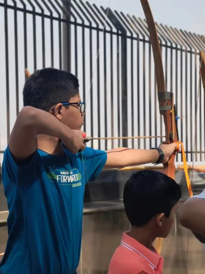 A young boy takes aim with precision. Our selection trials help us identify archers ready to move to the next level of competitive training.