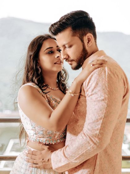 An intimate outdoor portrait from a Jaipur shoot. The focus is on the couple's close embrace and the beautiful natural light, creating a soft and romantic feel.