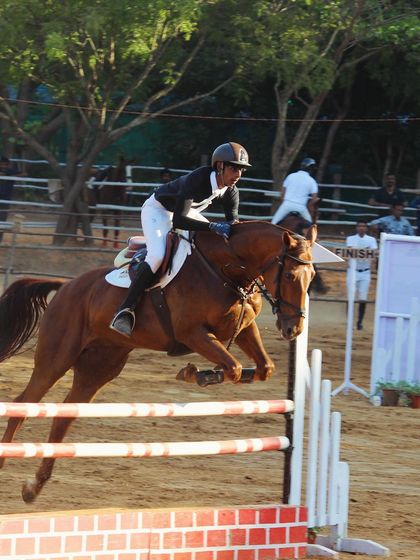 An action shot from the Auroville Horse Show, capturing the intensity and athleticism of show jumping as taught at my school.