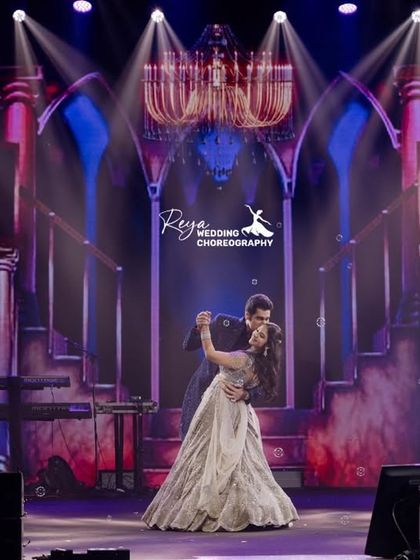 A classic ballroom dip against a grand, theatrical backdrop. This is how you create a show-stopping moment that feels like the finale of a romance film.