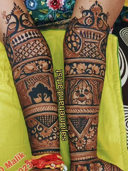 Bridal mehandi isn't complete without beautiful feet. This is an example of my full-coverage leg and feet henna, featuring intricate peacock and swan motifs, traditional jaali patterns, and delicate floral work that extends from the shin to the toes.