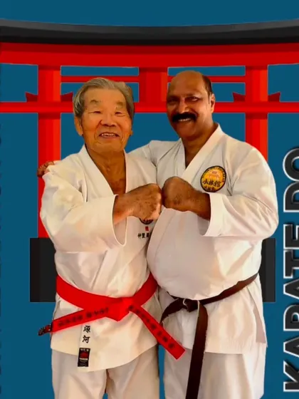 A friendly moment with a senior master, showcasing the camaraderie and respect that defines the global Shorinkan community.