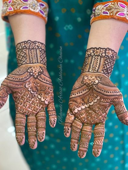 A beautiful example of a full coverage design with a focus on checkered patterns, also known as jaali work.