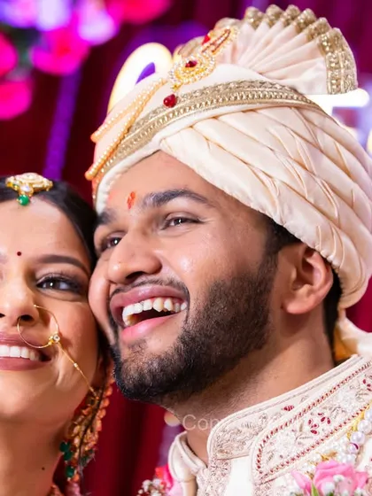 Amidst all the rituals, these moments of pure, shared laughter are priceless. I'm always ready to capture these candid expressions that show the true joy of the day.
