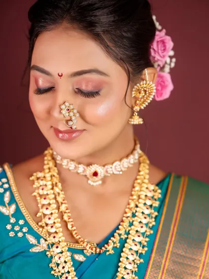 A close-up with eyes closed to showcase the smooth and well-blended eyeshadow work.