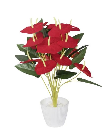 A vibrant red artificial anthurium plant. The glossy leaves and bright flowers provide a pop of color and are a popular choice for both home and office decor.