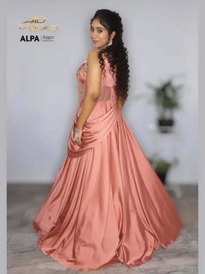The back view of the peach gown, showing how the hairstyle and overall look come together.