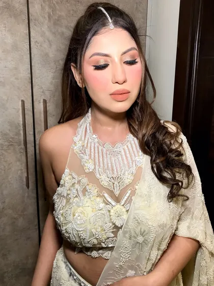 A close-up of her makeup, with the maang tikka adding a traditional touch to the modern styling.