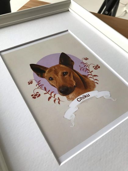 This angle of the framed Chiku portrait shows the depth created by the mat board, which separates the art from the glass for a professional gallery look.