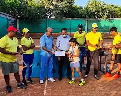 A young winner in the Under-8 Aptitude Test receives her award. My programs for young players include skill-based tests to track progress and build confidence.