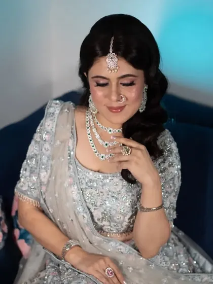 A close-up of the client's reception makeup. I focused on a soft smokey eye with a hint of pink, paired with a glowing complexion and a neutral lip.