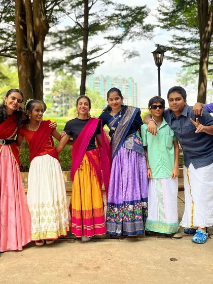 Fashion fades, but tradition is timeless. Our students look incredible in their vibrant sarees and veshtis, ready for a group performance that celebrates South Indian culture.