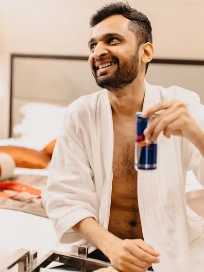 Who says the bride and groom can't get ready together? We love it when couples break the rules to make their day truly their own. This groom kept his bride company with a can of Red Bull, a perfect example of the relaxed, authentic moments we aim to capture.