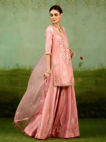 This extensive collection features a wide array of modern festive attire. From vibrant sharara sets and elegant anarkalis to chic jumpsuits and light lehengas, these pieces are curated for wedding guests and anyone looking for a stylish outfit for a special occasion.