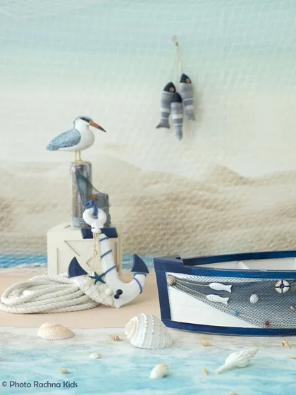 A detailed shot of the props used in our nautical theme, including the boat, anchor, and seagull, showing our attention to detail.
