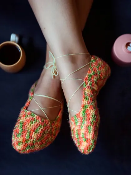 Get ready for cozy season with our handmade crochet booties. These are designed to look like ballet flats with a delicate lace-up detail, keeping your feet warm and stylish at home.
