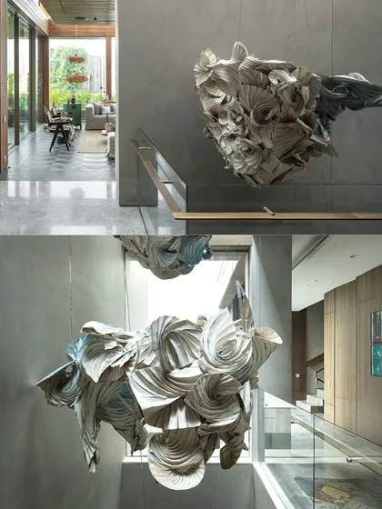 This installation, 'Pravaah', combines origami with the Indian Shibori dyeing technique. The piece uses folded fabric to abstractly retell the mythological story of the Radhakrishna Rasleela, embedding narrative and texture into the home.
