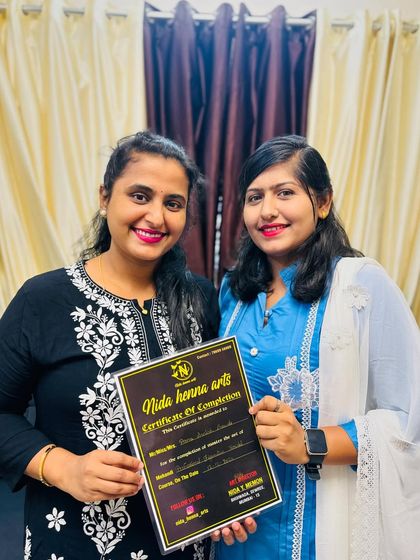 Celebrating another student's achievement. Her hard work and passion for mehandi have truly paid off.