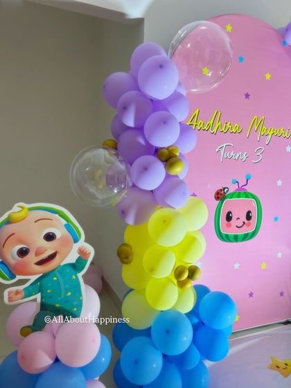 A closer look at the colorful balloon arrangement and character cutouts for our Cocomelon-themed party. We use characters like JJ to make the theme instantly recognizable for the kids.