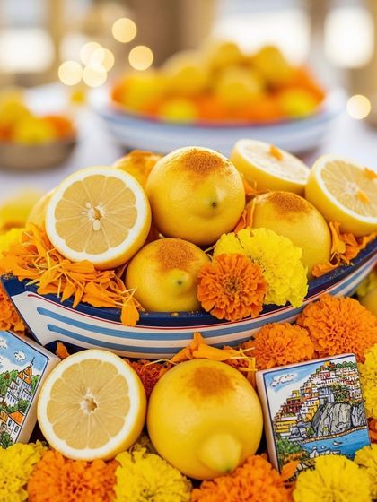 The beautiful lemon and marigold boat centerpiece, a unique and thematic detail that brings the essence of the Amalfi coast to the celebration.