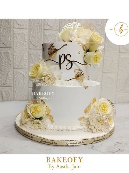 I loved making this cake for a couple's 50th anniversary. The off-white and gold tones create such an elegant look. The bottom tier was a rich chocolate mousse and the top was a light fresh fruit flavor.