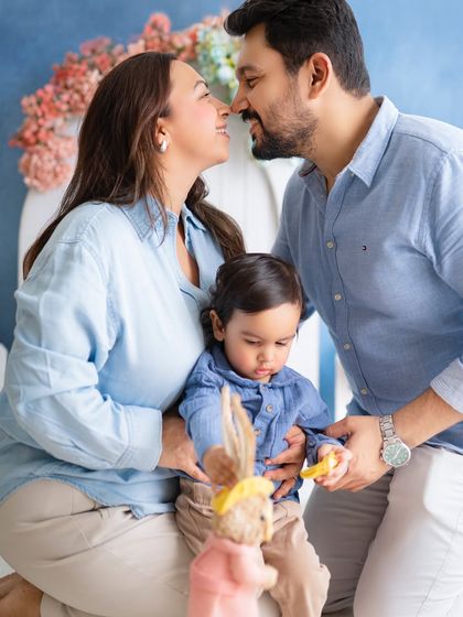 A sweet and intimate moment between parents while their son plays. This captures the love of the couple as well as their love for their child.
