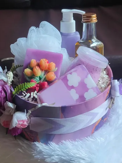 This lavender-themed self-care basket is perfect for relaxation. It's filled with lavender bodywash, whipped soap, soap bars, and bhringraj hair oil.
