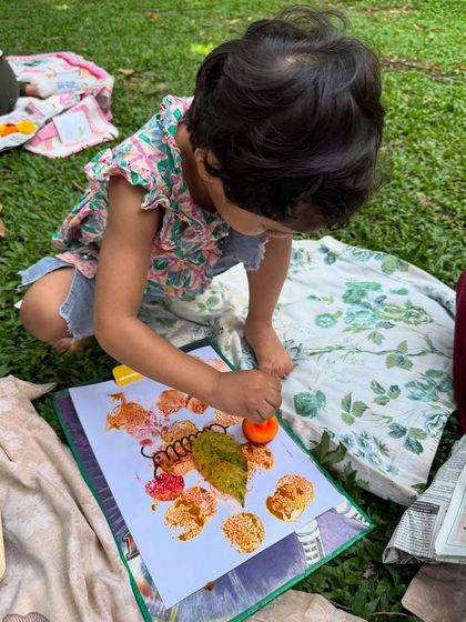 Using a simple stamp to create patterns with natural pigments. This activity helps develop fine motor skills while allowing children to experiment with colours made from the earth.