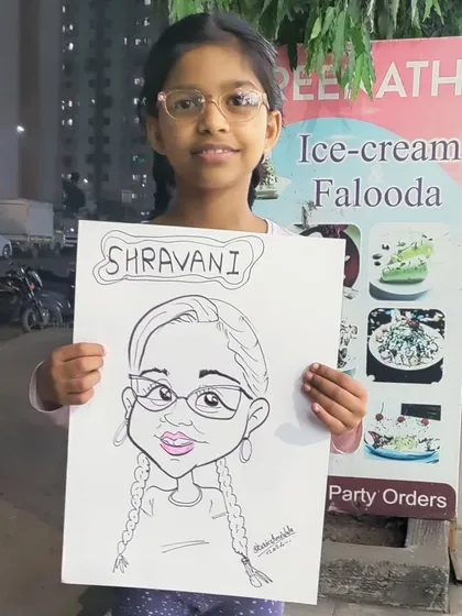 A happy young client with her personalized caricature. I can work in any party setting, indoors or outdoors, to entertain your guests.