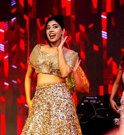 Two bridesmaids in perfect sync, enjoying their performance.