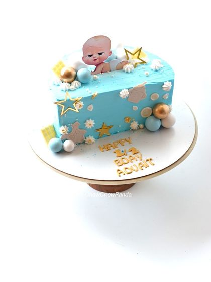 A half-birthday cake with a Boss Baby theme. This half-cut mango cake is perfect for celebrating 6 months.