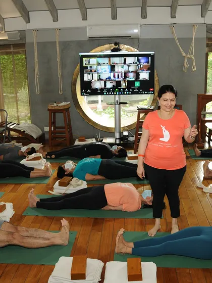 Every journey begins with a single step. Here I am guiding a class of students in Savasana, some in person and some online, at the start of their transformative path.