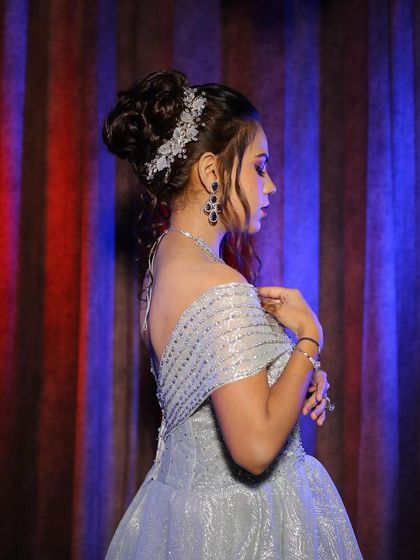 A complete engagement look photoshoot featuring our silver off-shoulder ball gown. The series of five images provides a comprehensive look at the final result.