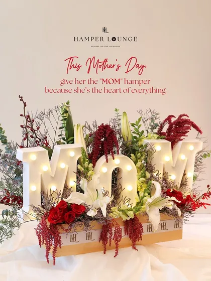 For Mother's Day, I wanted to create something that literally spells out love. This statement hamper features illuminated 'MOM' letters nestled in a bed of fresh, vibrant florals, making it a tribute to her love, strength, and magic.