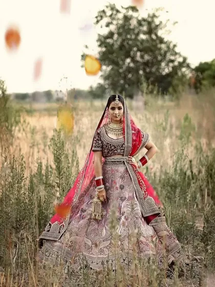 A beautiful outdoor bridal portrait in a field, with a soft, natural light that gives the photo a dreamy quality.