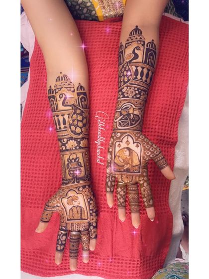 Another angle of the custom bridal mehendi with portraits of the couple and their dog.
