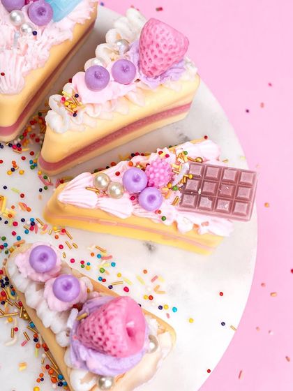 A closer look at my pastry slice candles. I layer different colored waxes to mimic cake and filling, then top them with piped frosting, fruit, and chocolate details. They are a sweet, calorie-free indulgence for your eyes.