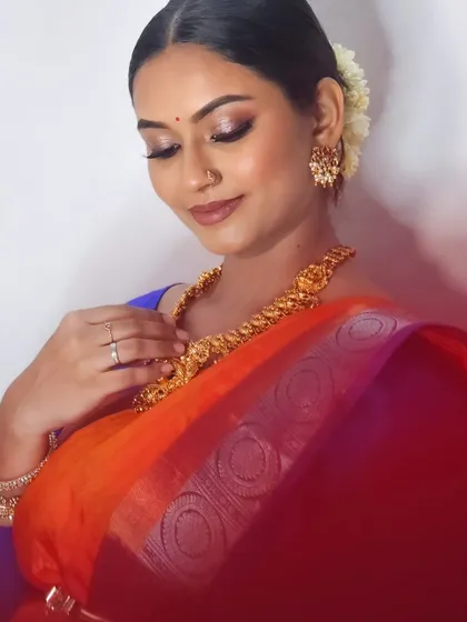 A close-up of my self-makeup look, showing the detailed eye makeup and the beautiful jewelry.