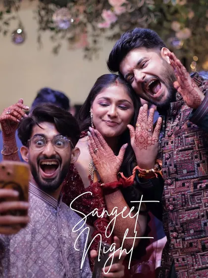A fun selfie moment with the couple and their friends. These unposed, joyful photos are often the most memorable from a Sangeet night.